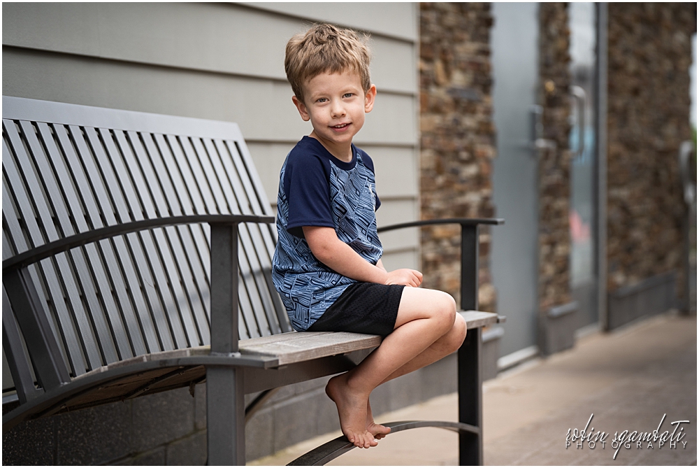 boy sitting on bench