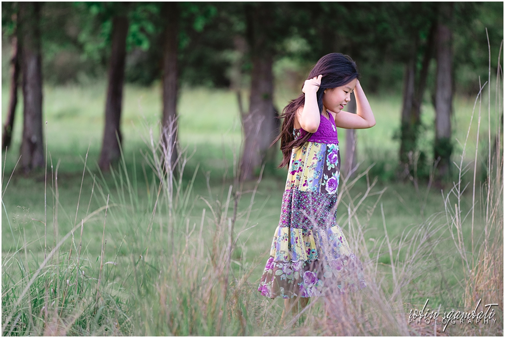 girl walking in tall grass